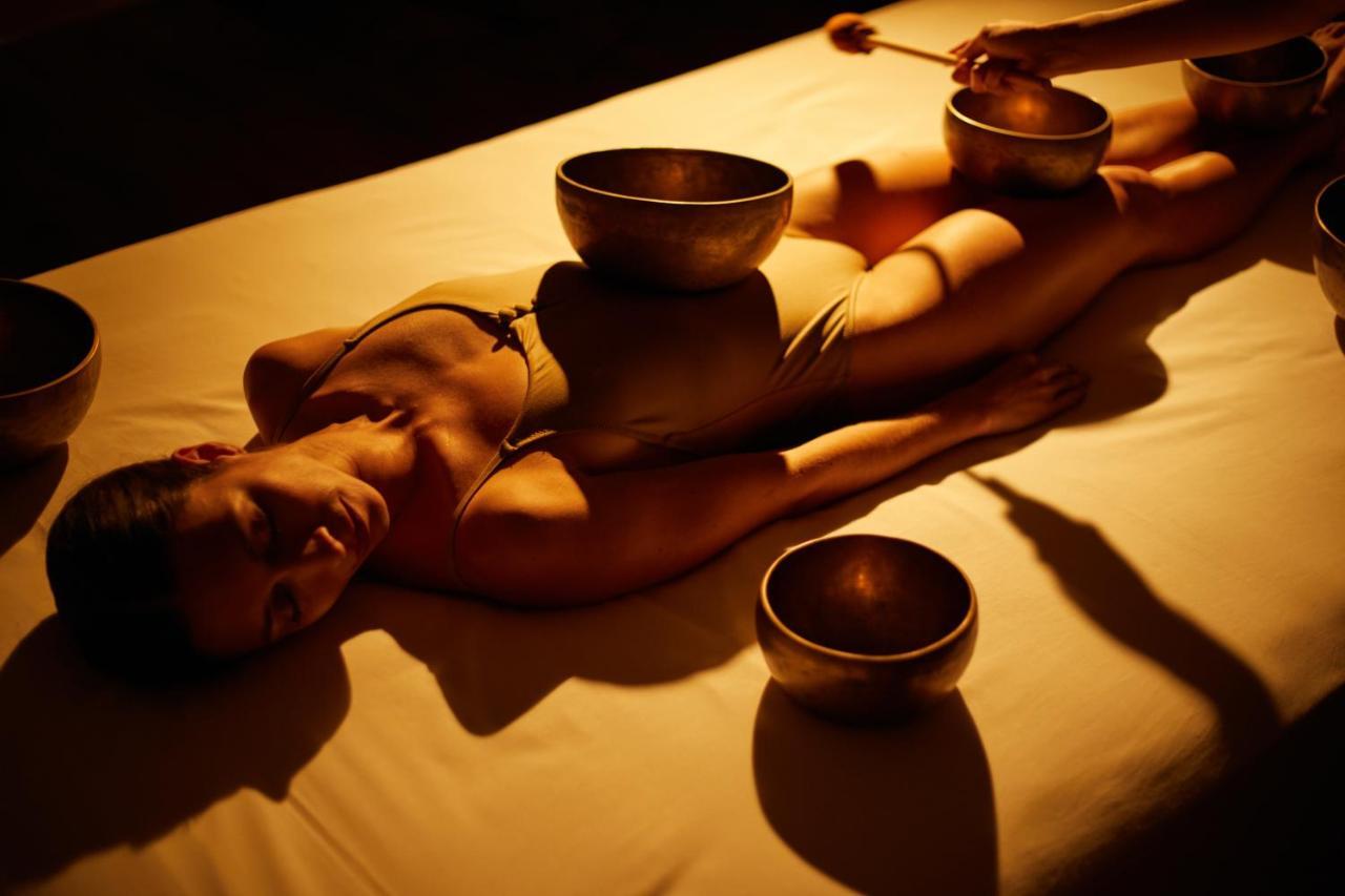 Secrets Lanzarote Resort & Spa - Adults Only Puerto Calero Exteriér fotografie A woman receiving a singing bowl massage